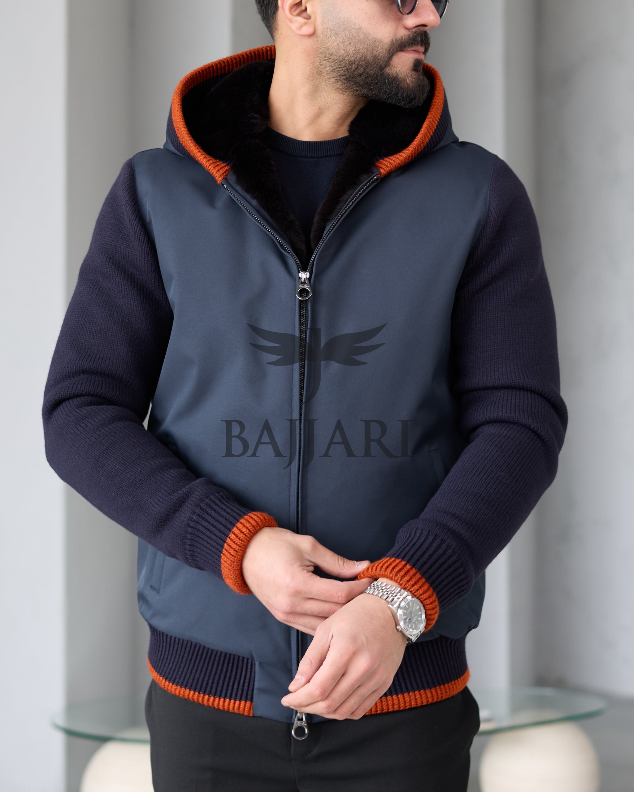 Men's hooded jacket with fur lining, knitted fabric sleeves, and waterproof fabric