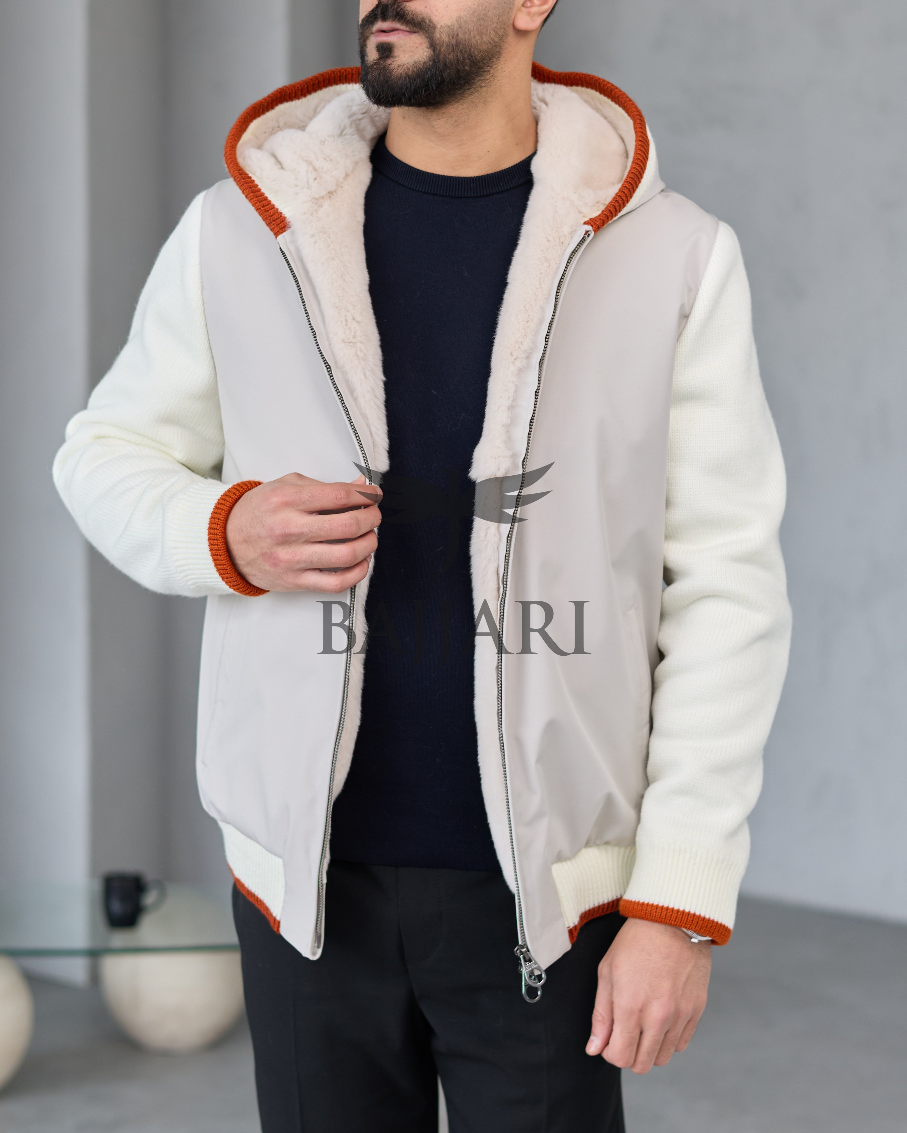 Men's hooded jacket with fur lining, knitted fabric sleeves, and waterproof fabric
