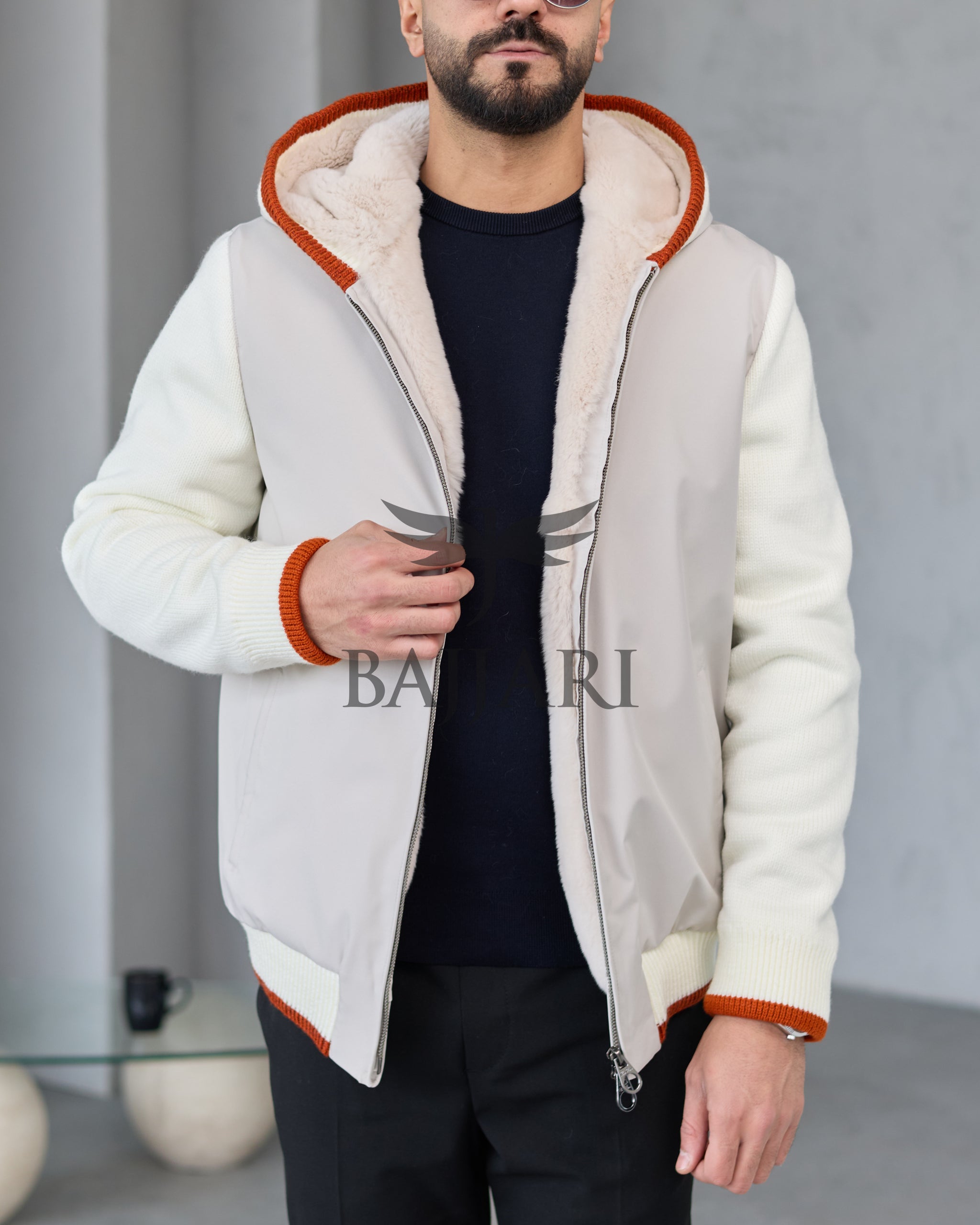 Men's hooded jacket with fur lining, knitted fabric sleeves, and waterproof fabric